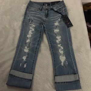 Distressed denim skinny jeans